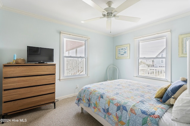 bedroom featuring ornamental molding, carpet flooring, and ceiling fan