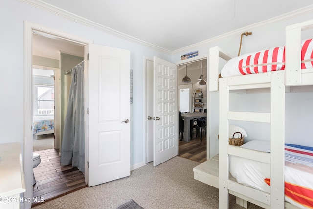 bedroom featuring hardwood / wood-style floors and ornamental molding