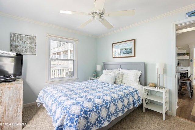 bedroom featuring carpet, ceiling fan, and crown molding