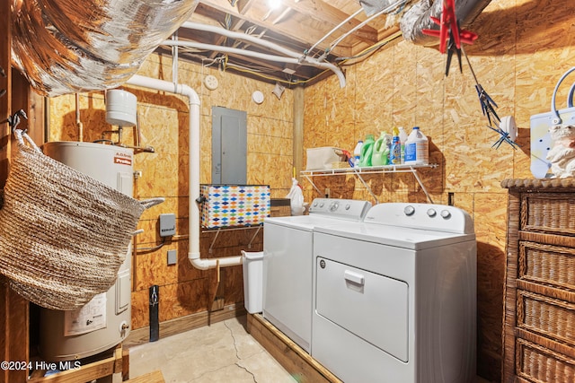 laundry room featuring electric panel, separate washer and dryer, and electric water heater