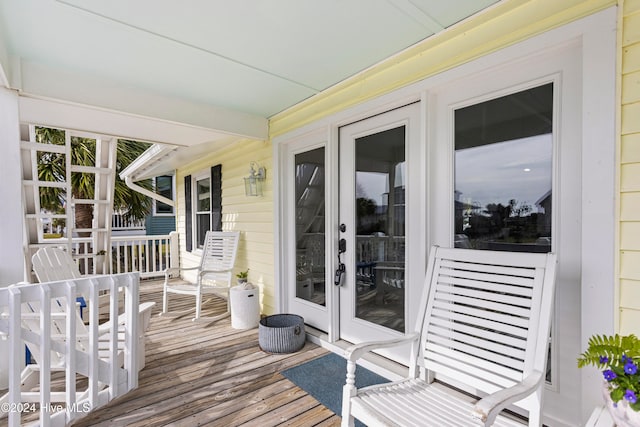 wooden deck featuring french doors