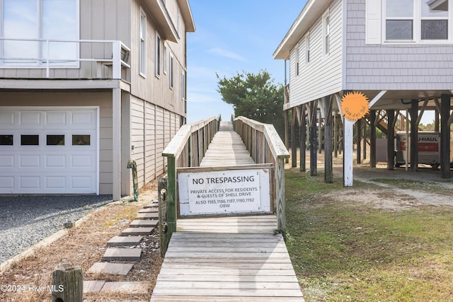 exterior space featuring a balcony and a garage