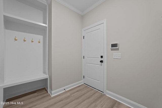 mudroom featuring light hardwood / wood-style floors and ornamental molding