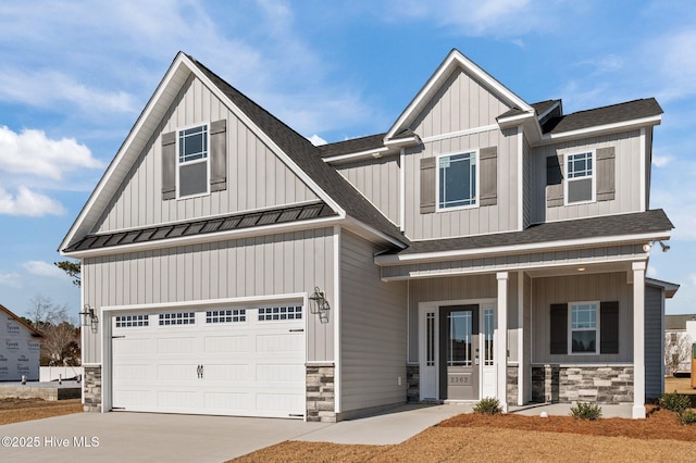 craftsman-style home featuring covered porch and a garage