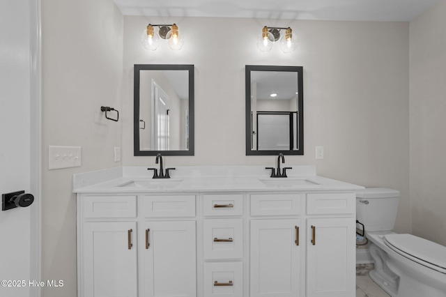 bathroom featuring vanity and toilet