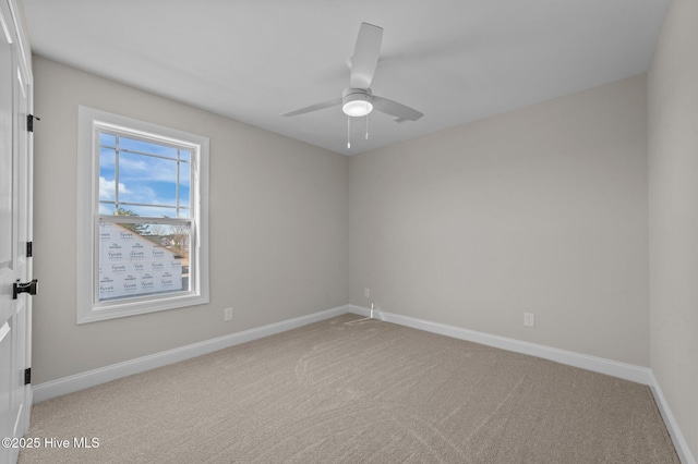 empty room with ceiling fan and carpet floors