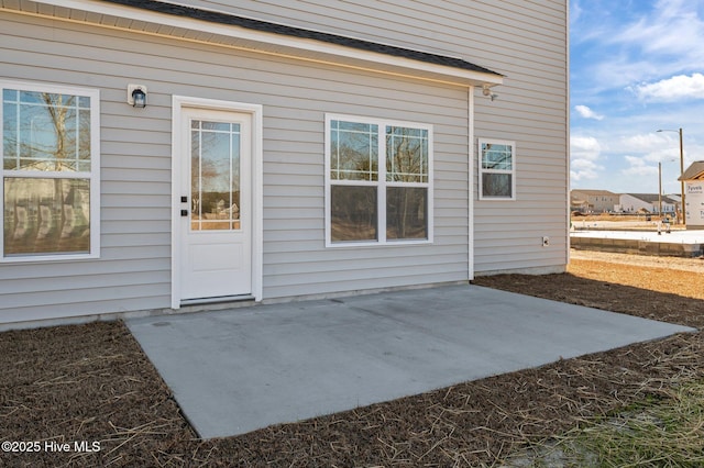 property entrance featuring a patio