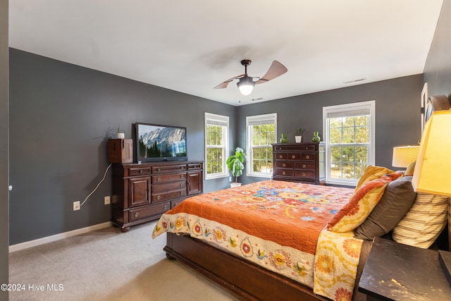 bedroom featuring ceiling fan and light colored carpet