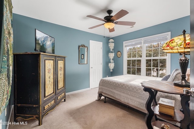 carpeted bedroom with ceiling fan