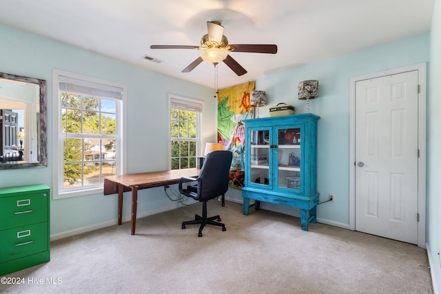 office with light carpet and ceiling fan