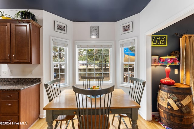 dining area with light hardwood / wood-style floors