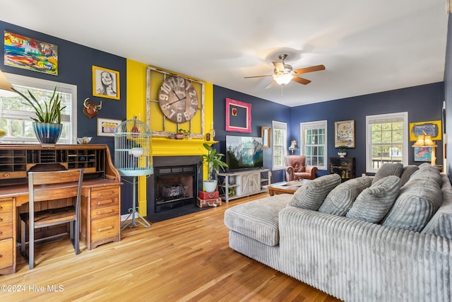 living room with hardwood / wood-style flooring and ceiling fan