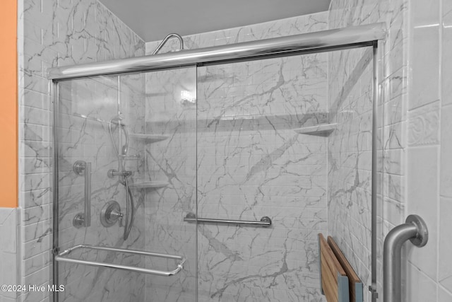 bathroom featuring an enclosed shower