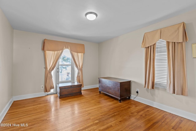 unfurnished room with light hardwood / wood-style flooring