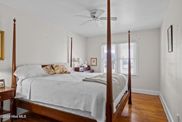 1701 Front St, Beaufort, NC 28516 - bedroom with baseboards, wood finished floors, and a ceiling fan