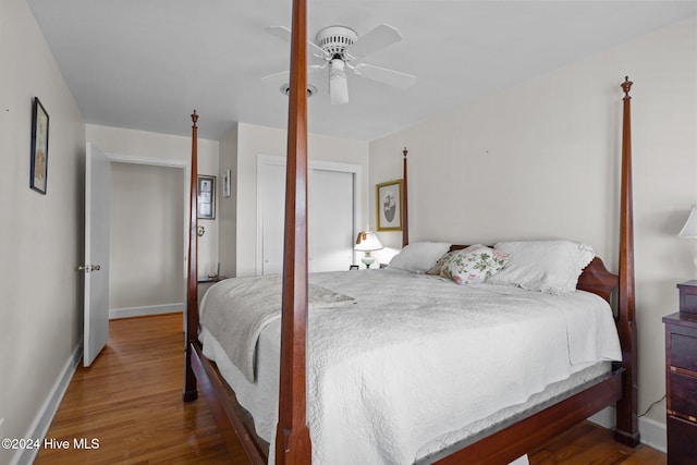 bedroom featuring hardwood / wood-style flooring and ceiling fan