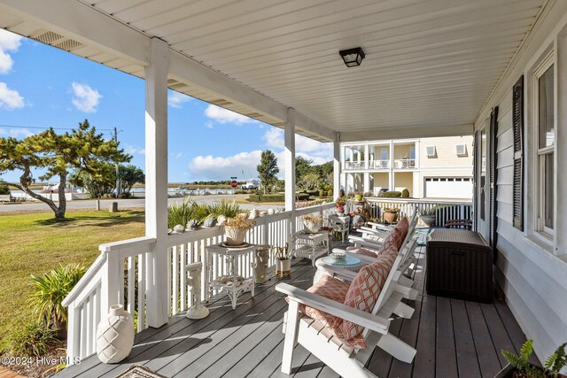 1701 Front St, Beaufort, NC 28516 - wooden porch featuring a yard