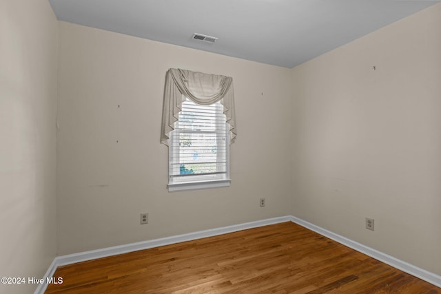 unfurnished room featuring wood-type flooring