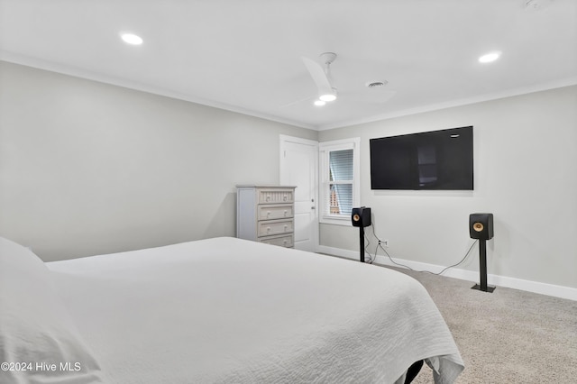 bedroom featuring ceiling fan, light carpet, and ornamental molding