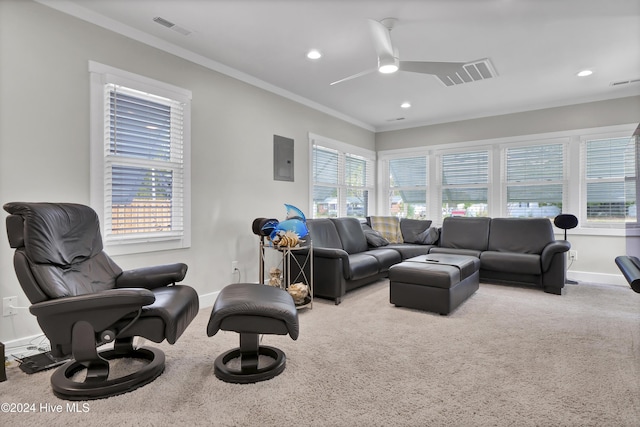 living room featuring carpet, electric panel, ceiling fan, and crown molding