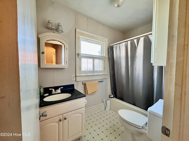 full bathroom featuring tile patterned flooring, shower / bath combo, vanity, and toilet