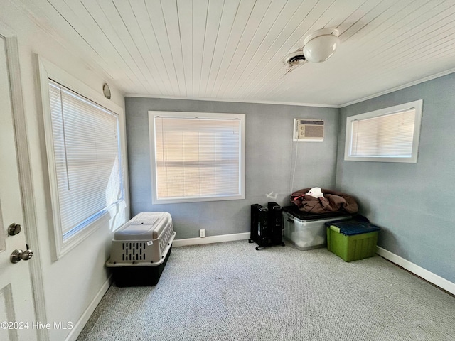 sitting room with a wall mounted AC, crown molding, carpet, and wooden ceiling