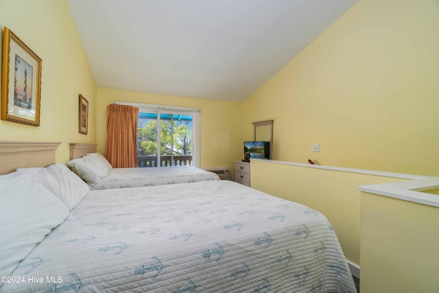 bedroom with lofted ceiling