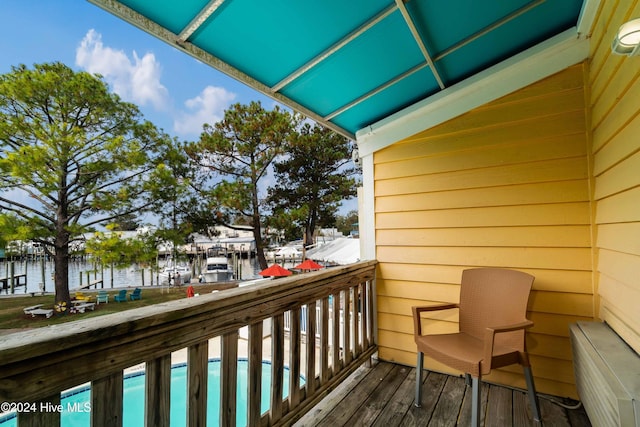 balcony featuring a water view