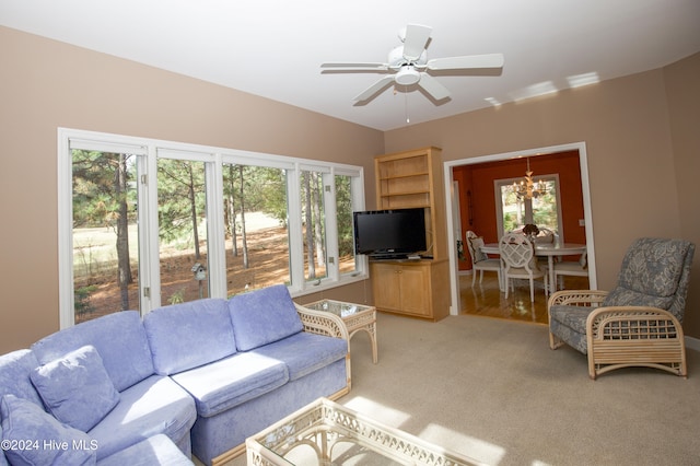 living room with carpet flooring, plenty of natural light, and ceiling fan