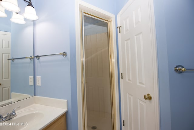 bathroom featuring vanity and walk in shower