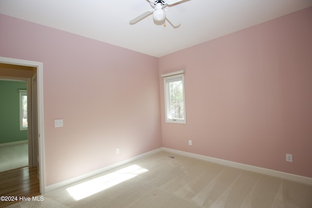 carpeted empty room with ceiling fan