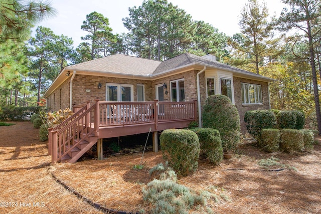 rear view of house with a deck