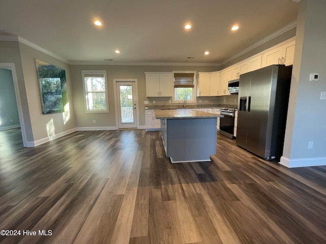 kitchen featuring white cabinets, a kitchen island, stainless steel appliances, and dark hardwood / wood-style floors