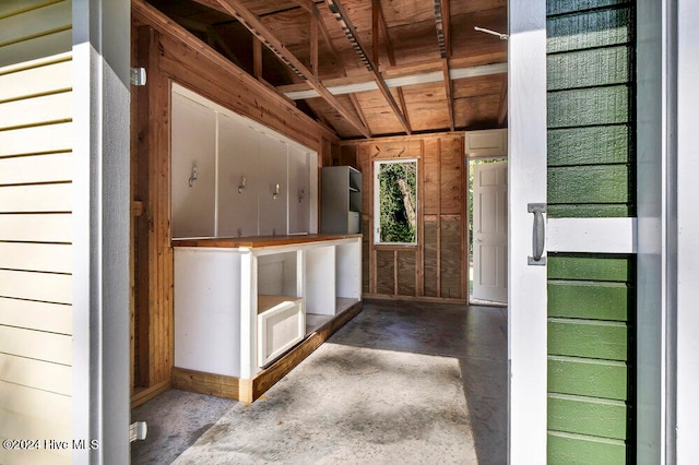 interior space featuring wood walls