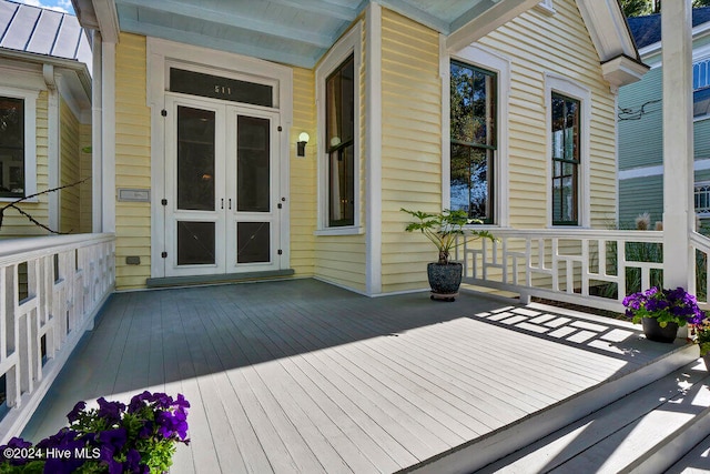 wooden terrace featuring french doors