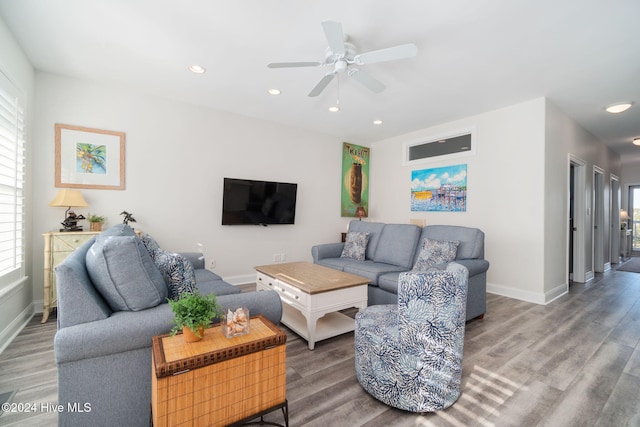 living room featuring hardwood / wood-style flooring and a healthy amount of sunlight