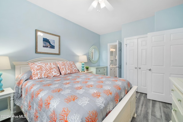 bedroom featuring connected bathroom, dark hardwood / wood-style floors, a closet, and ceiling fan