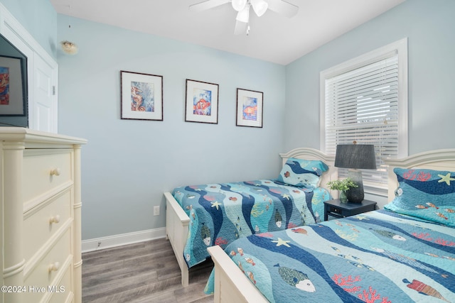 bedroom with hardwood / wood-style flooring and ceiling fan