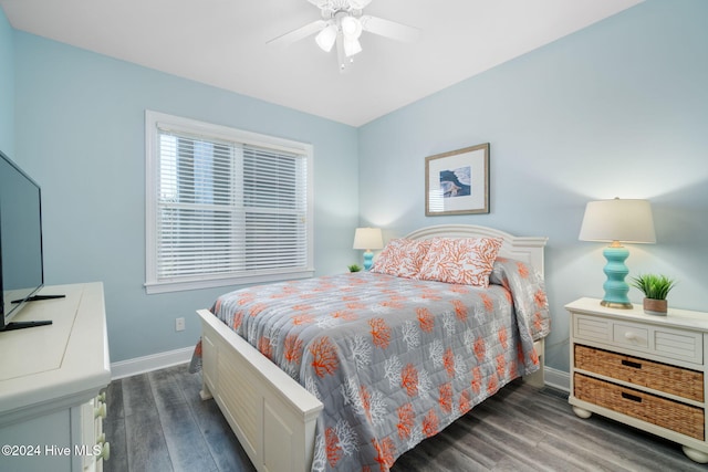 bedroom with ceiling fan and dark hardwood / wood-style flooring