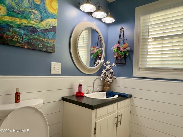 bathroom featuring vanity and toilet