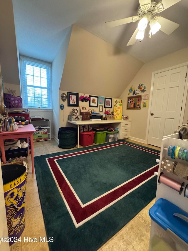 recreation room featuring ceiling fan and vaulted ceiling