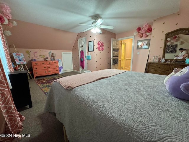 bedroom featuring ceiling fan, carpet flooring, and lofted ceiling