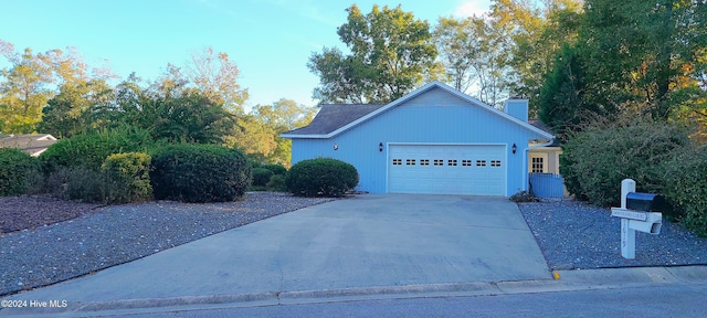 view of side of home featuring a garage