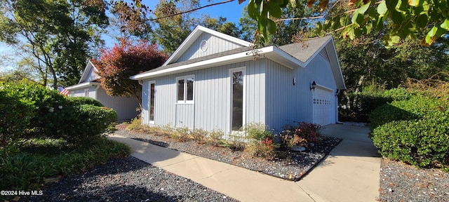 view of side of property with a garage