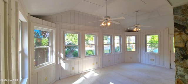 unfurnished sunroom with a wealth of natural light, ceiling fan, and vaulted ceiling