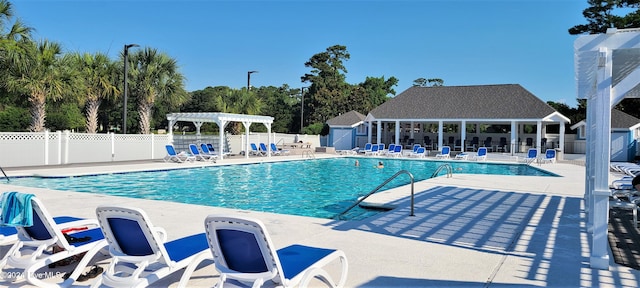 view of swimming pool featuring a patio area