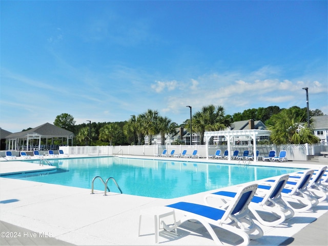 view of swimming pool with a patio