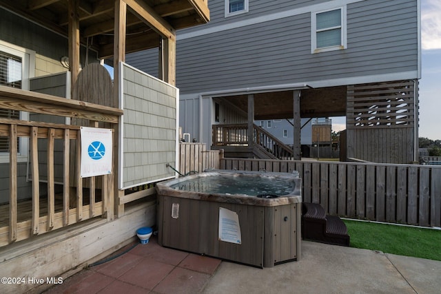 view of patio / terrace with a hot tub