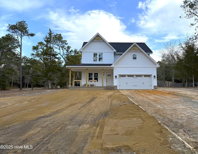 view of front of property featuring driveway and a porch