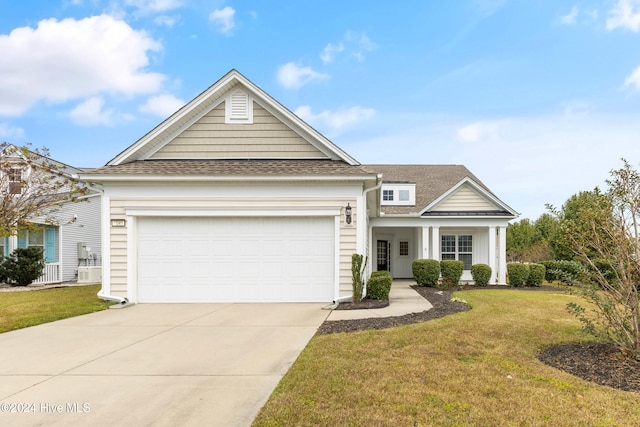 view of front of property featuring a front lawn and a garage